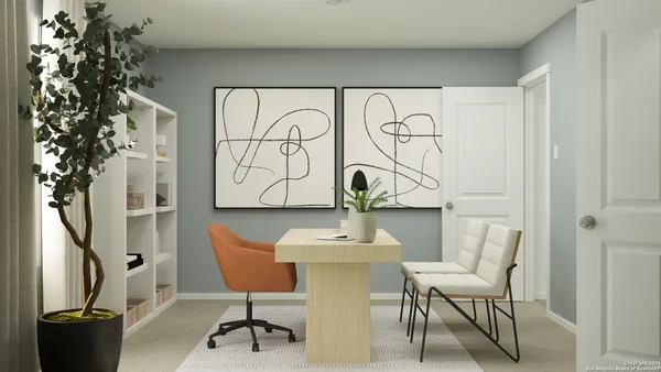 a view of a chairs and table in a room