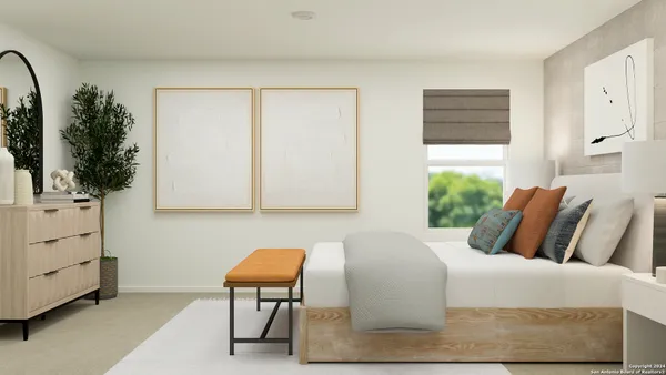 a bedroom with a bed and chair