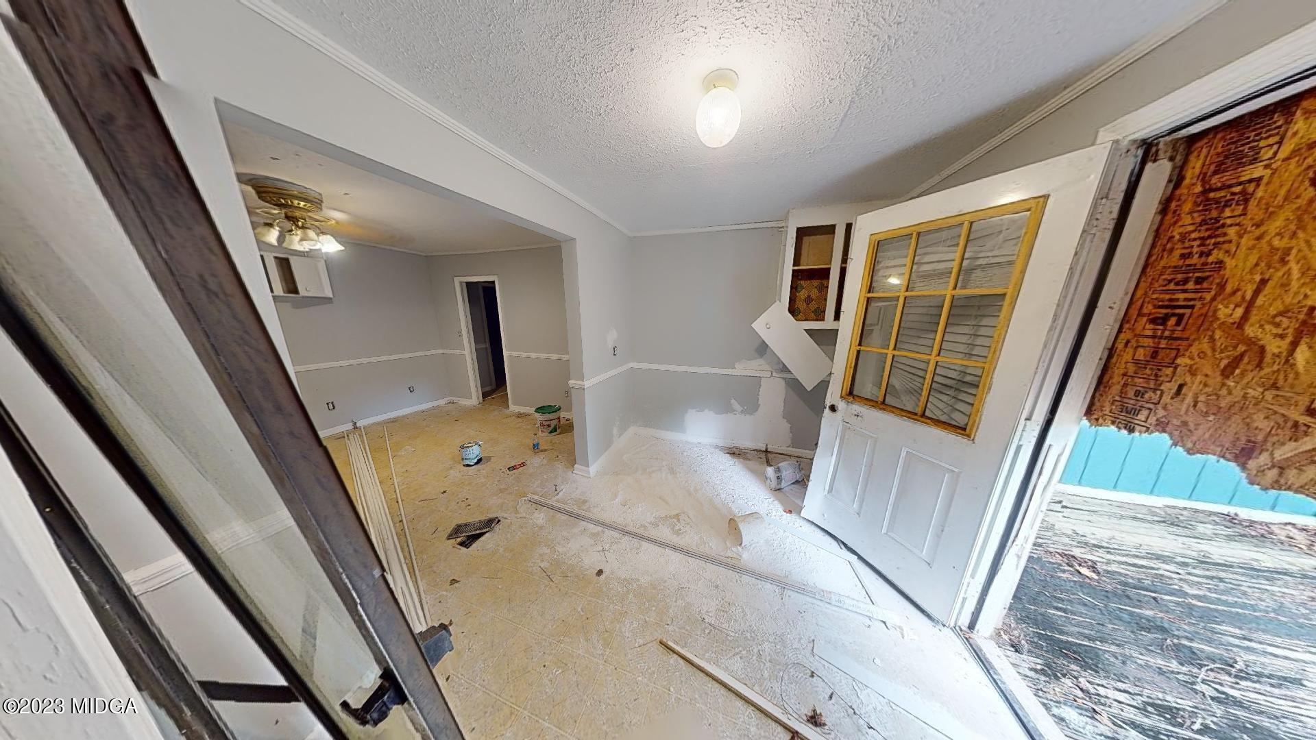 4521 Brookhaven Road Macon, GA 31206 - Photo 11 of 25 a view of a hallway with wooden floor and door