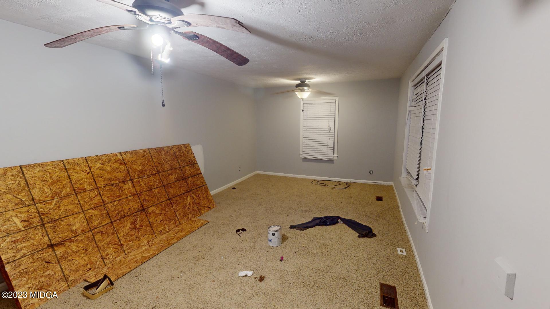 4521 Brookhaven Road Macon, GA 31206 - Photo 12 of 25 a bathroom with a tub and a shower