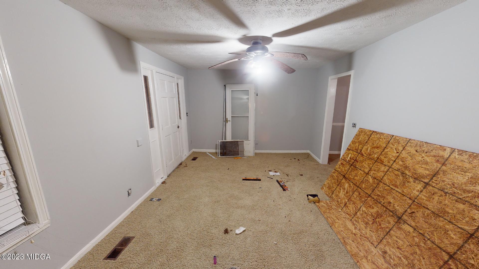 4521 Brookhaven Road Macon, GA 31206 - Photo 13 of 25 a view of a livingroom with a ceiling fan and window