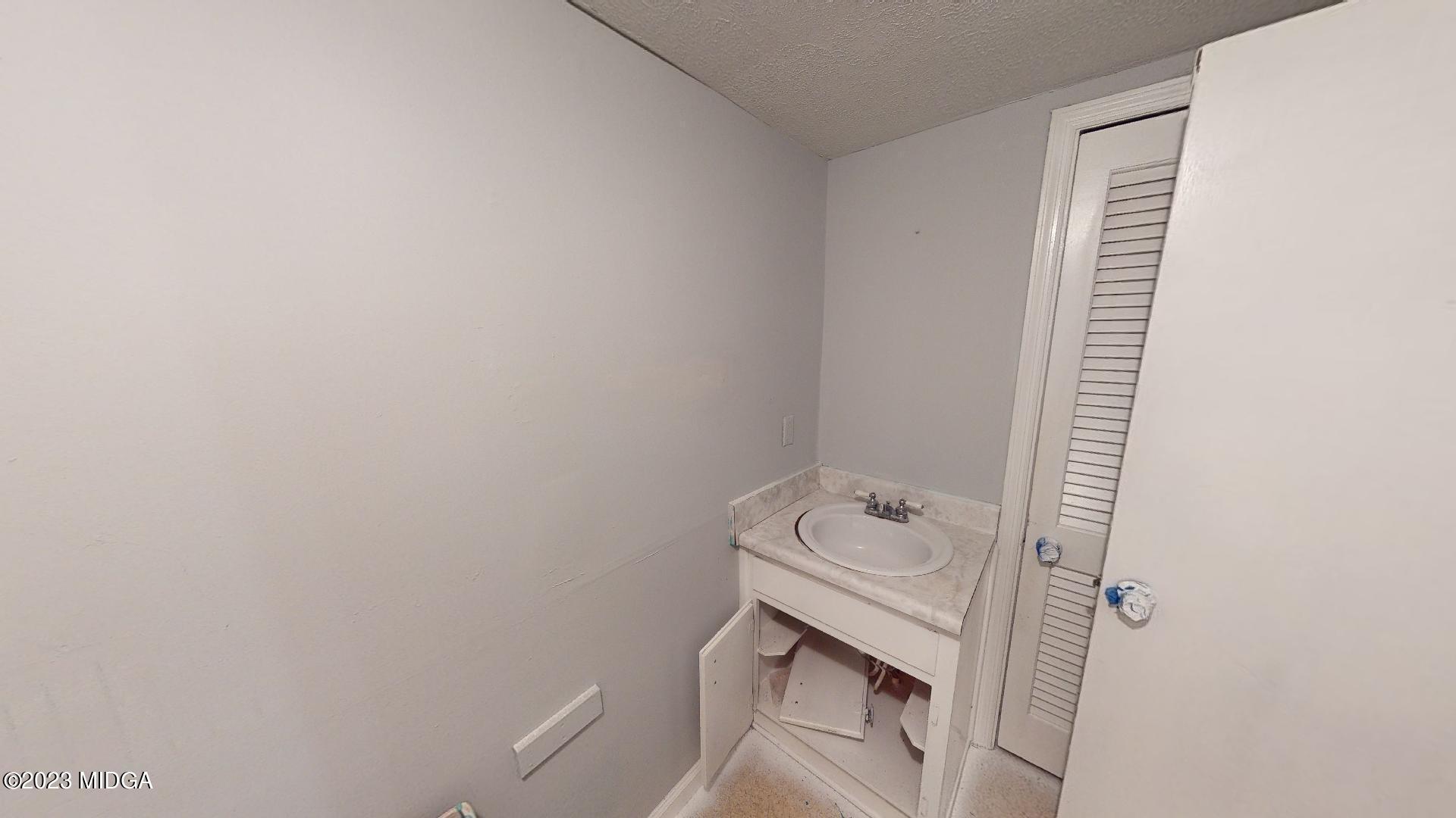 4521 Brookhaven Road Macon, GA 31206 - Photo 18 of 25 a bathroom with a sink and toilet