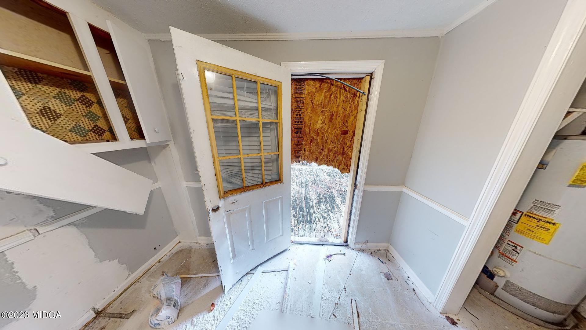 4521 Brookhaven Road Macon, GA 31206 - Photo 9 of 25 a view of front door with wooden floor and stairs