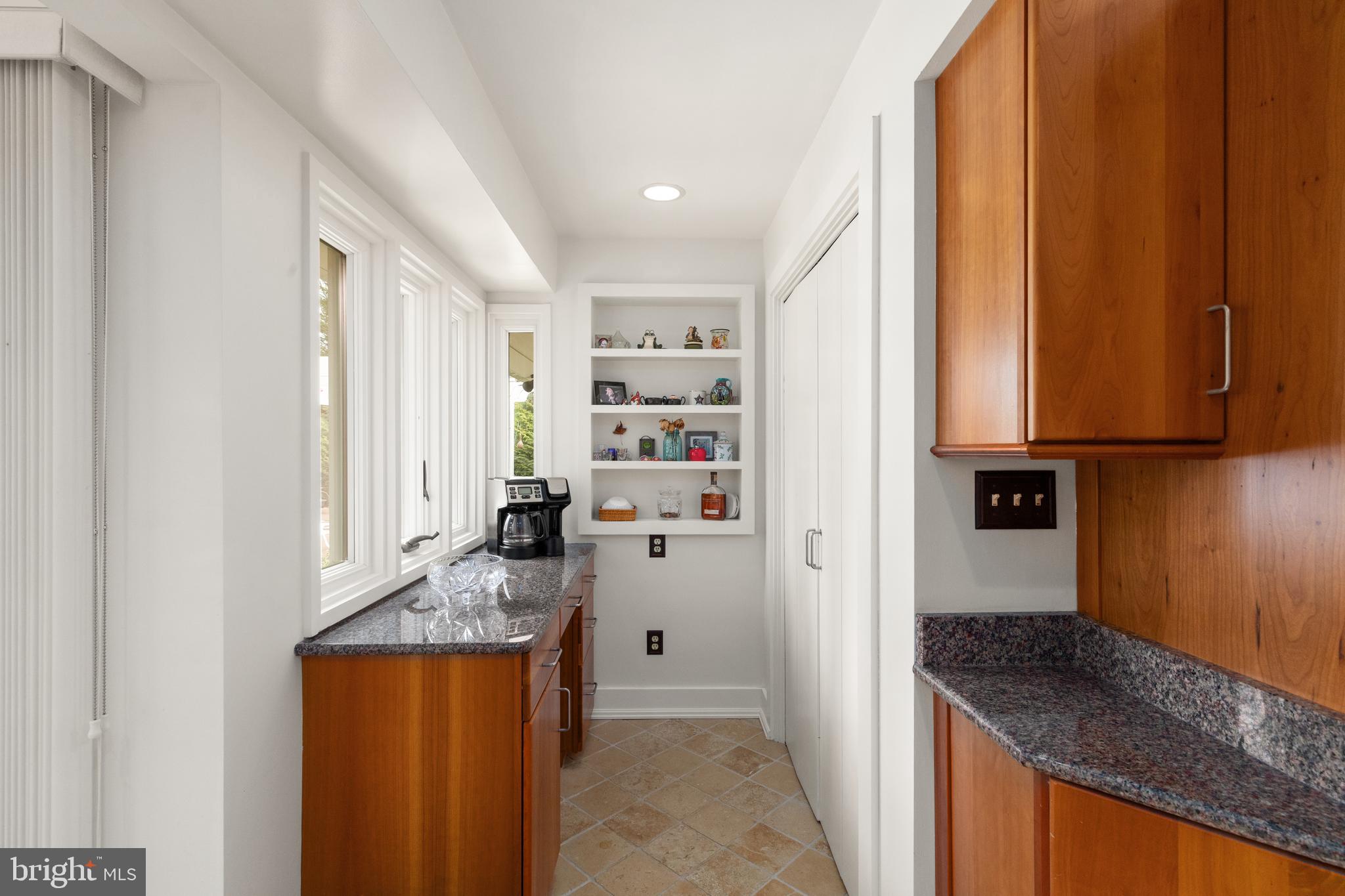 1403 Ellenglen Road Towson, MD 21286 - Photo 11 of 40 a kitchen with granite countertop cabinets and refrigerator