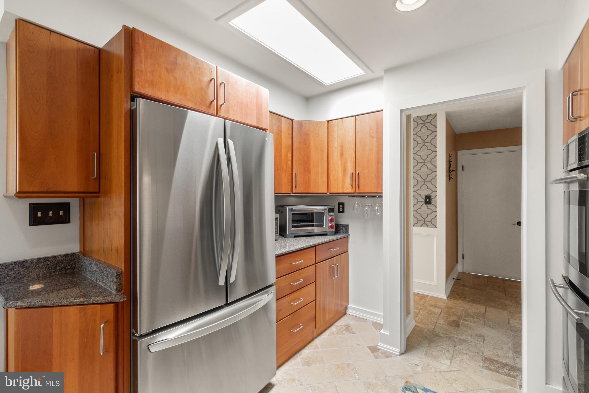 1403 Ellenglen Road Towson, MD 21286 - Photo 14 of 40 a kitchen with stainless steel appliances granite countertop a refrigerator and a stove top oven