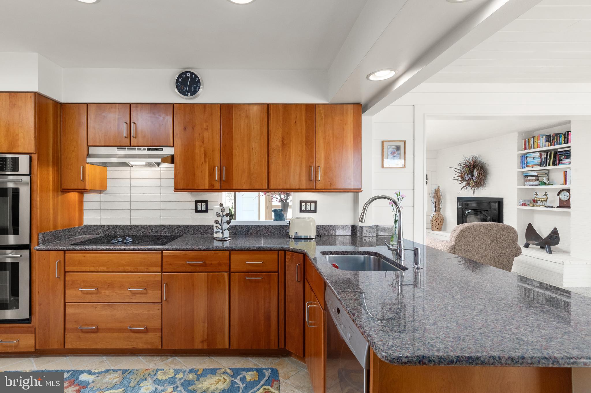 1403 Ellenglen Road Towson, MD 21286 - Photo 17 of 40 a kitchen with granite countertop a sink and cabinets