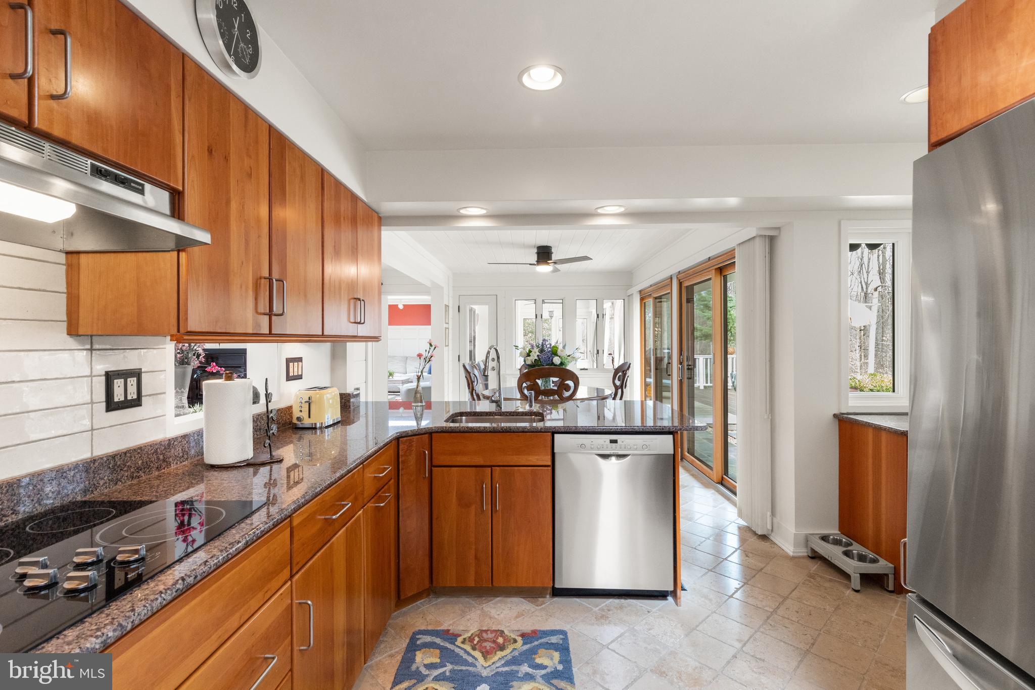 1403 Ellenglen Road Towson, MD 21286 - Photo 18 of 40 a kitchen with stainless steel appliances granite countertop a sink stove and refrigerator