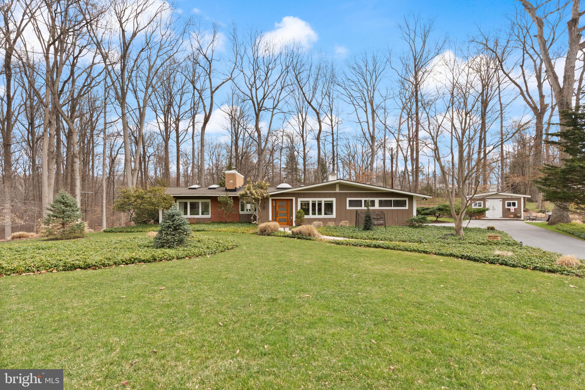 1403 Ellenglen Road Towson, MD 21286 - Photo 2 of 40 a front view of a house with a garden and trees