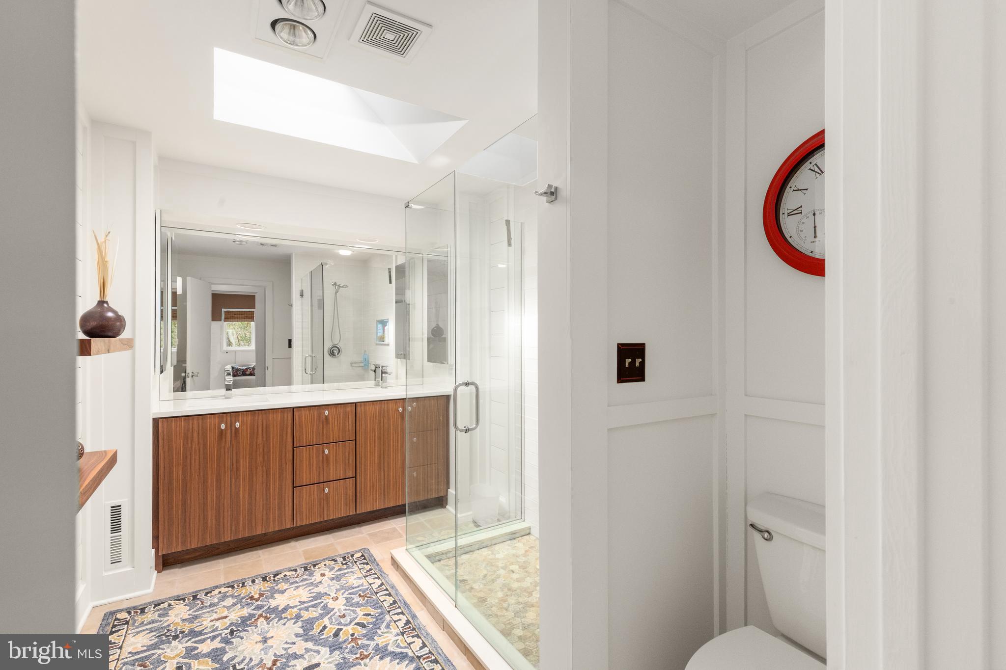 1403 Ellenglen Road Towson, MD 21286 - Photo 28 of 40 a bathroom with a sink and a mirror