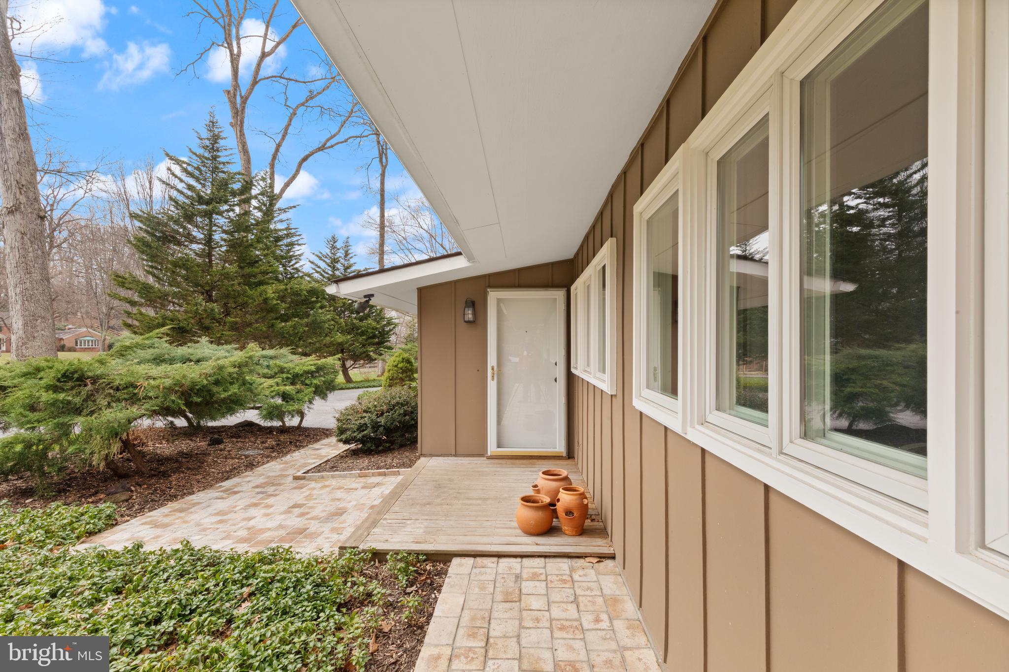1403 Ellenglen Road Towson, MD 21286 - Photo 5 of 40 a view of a house with a yard and potted plants