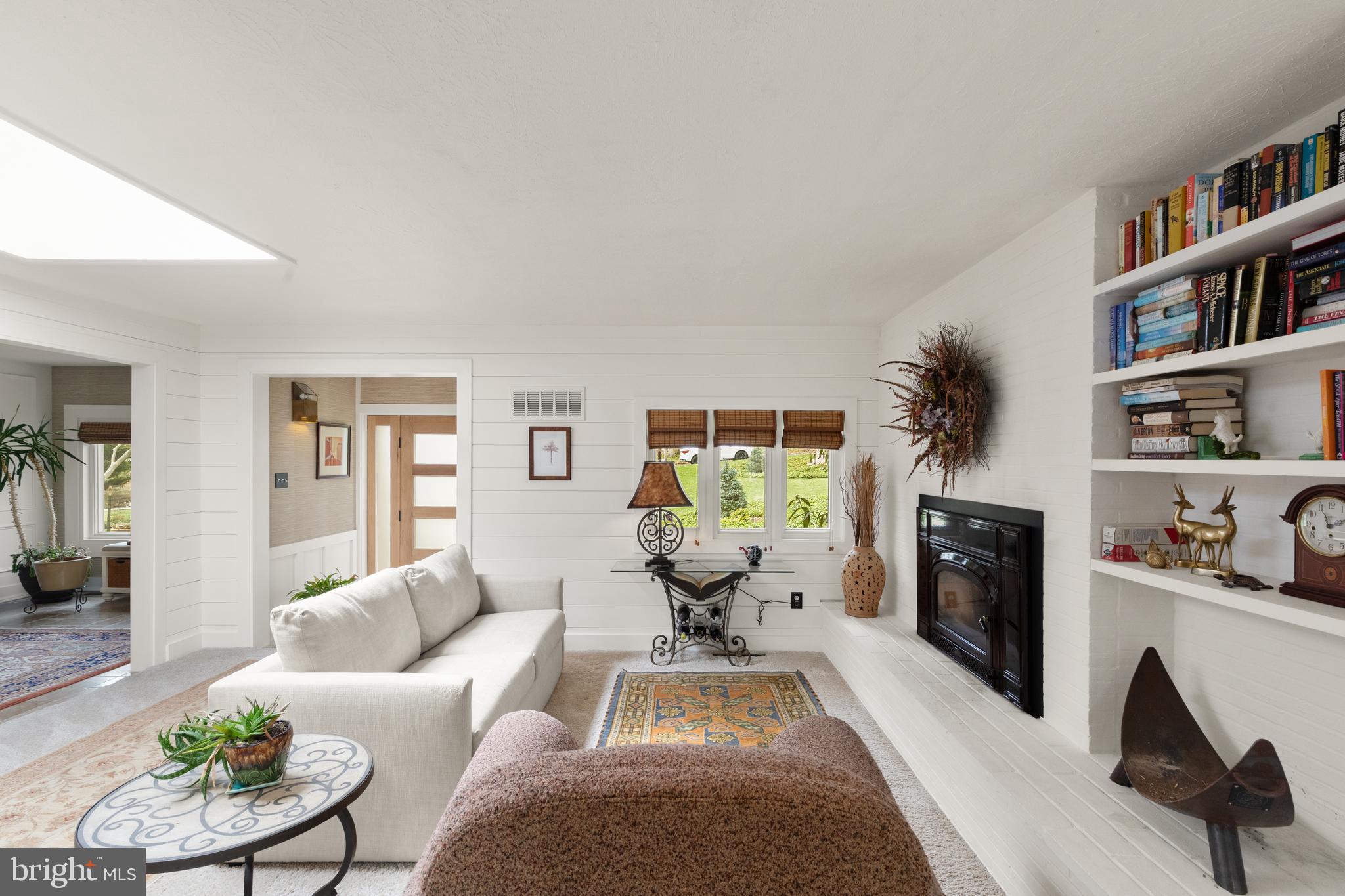 1403 Ellenglen Road Towson, MD 21286 - Photo 8 of 40 a living room with furniture and a fireplace
