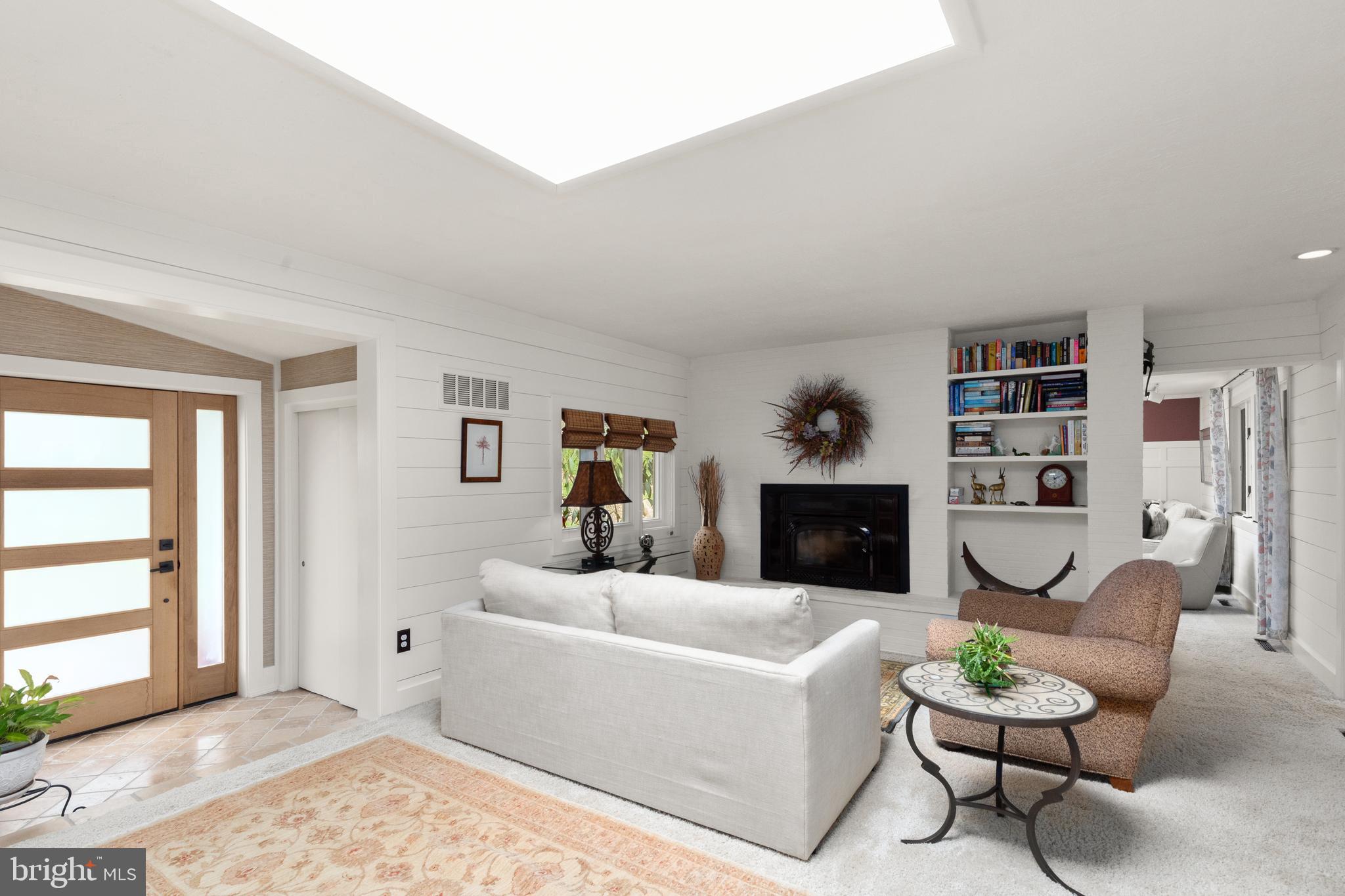 1403 Ellenglen Road Towson, MD 21286 - Photo 9 of 40 a living room with furniture and a fireplace