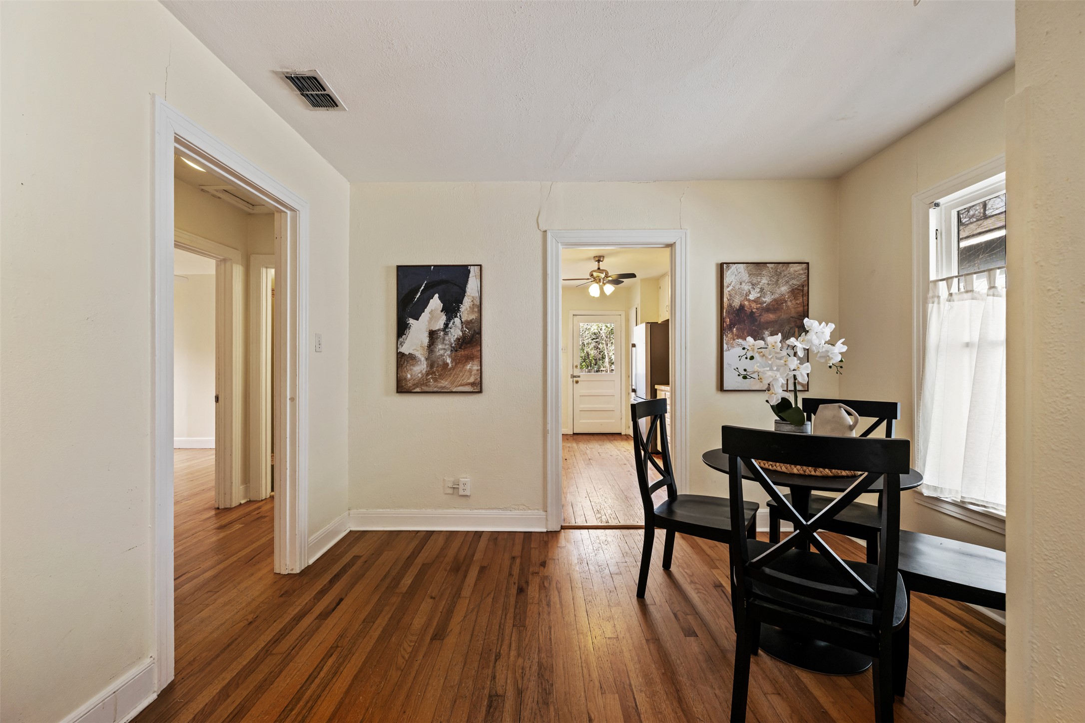 813 East 48th Street Austin, TX 78751 - Photo 11 of 37 a view of a dining room with furniture and wooden floor