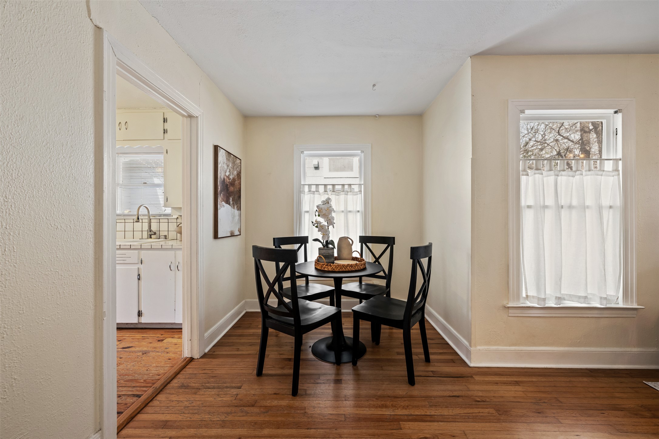 813 East 48th Street Austin, TX 78751 - Photo 13 of 37 a view of a dining room with furniture and wooden floor