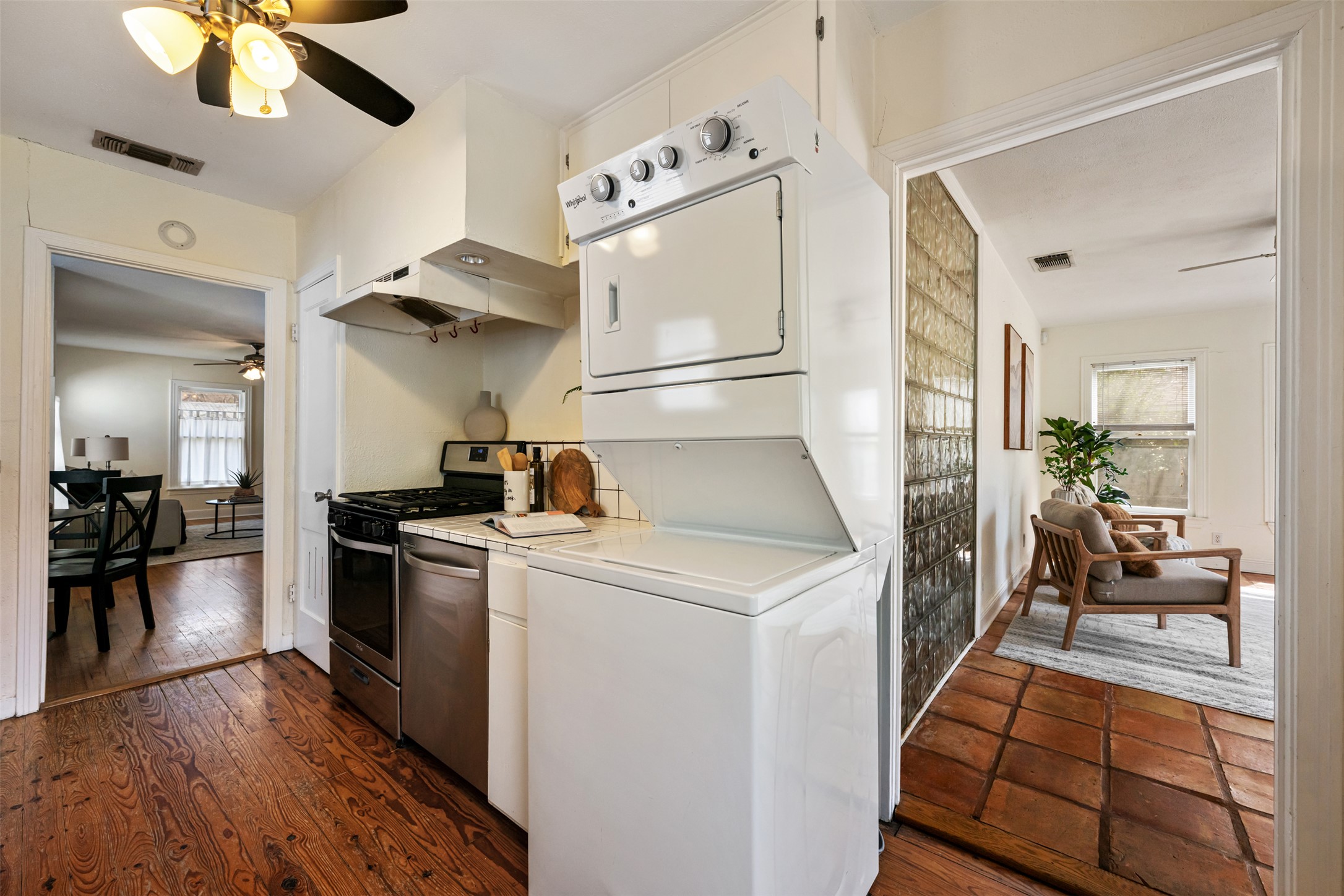 813 East 48th Street Austin, TX 78751 - Photo 18 of 37 a kitchen with stainless steel appliances a stove a refrigerator and a fireplace