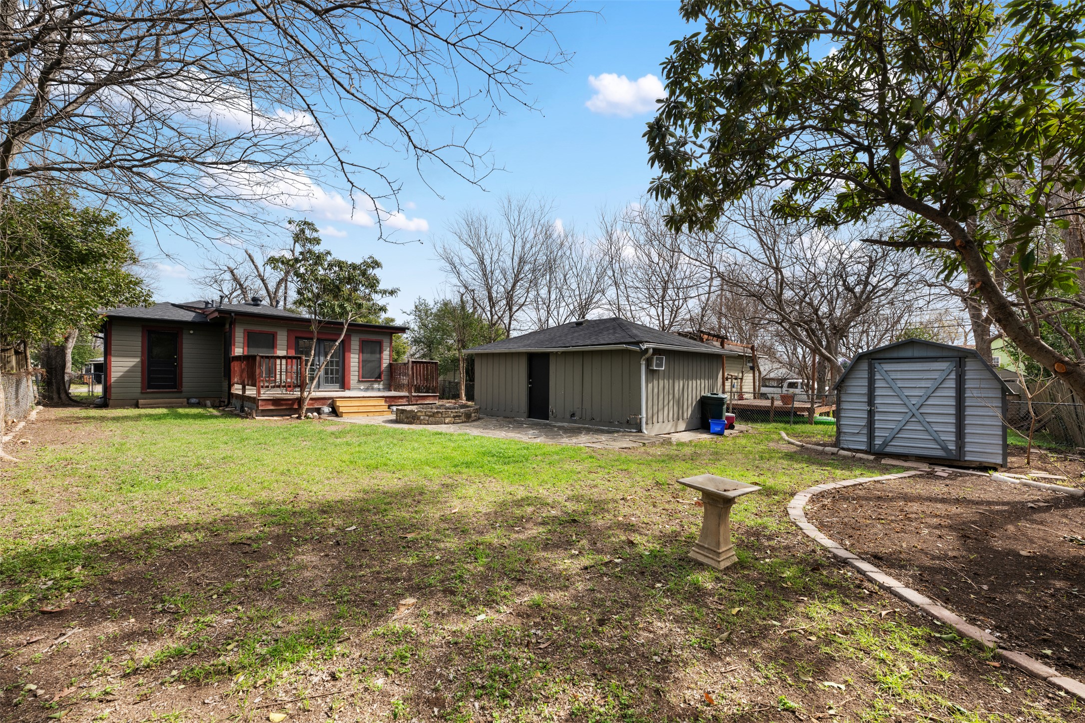 813 East 48th Street Austin, TX 78751 - Photo 31 of 37 a front view of a house with a garden and trees