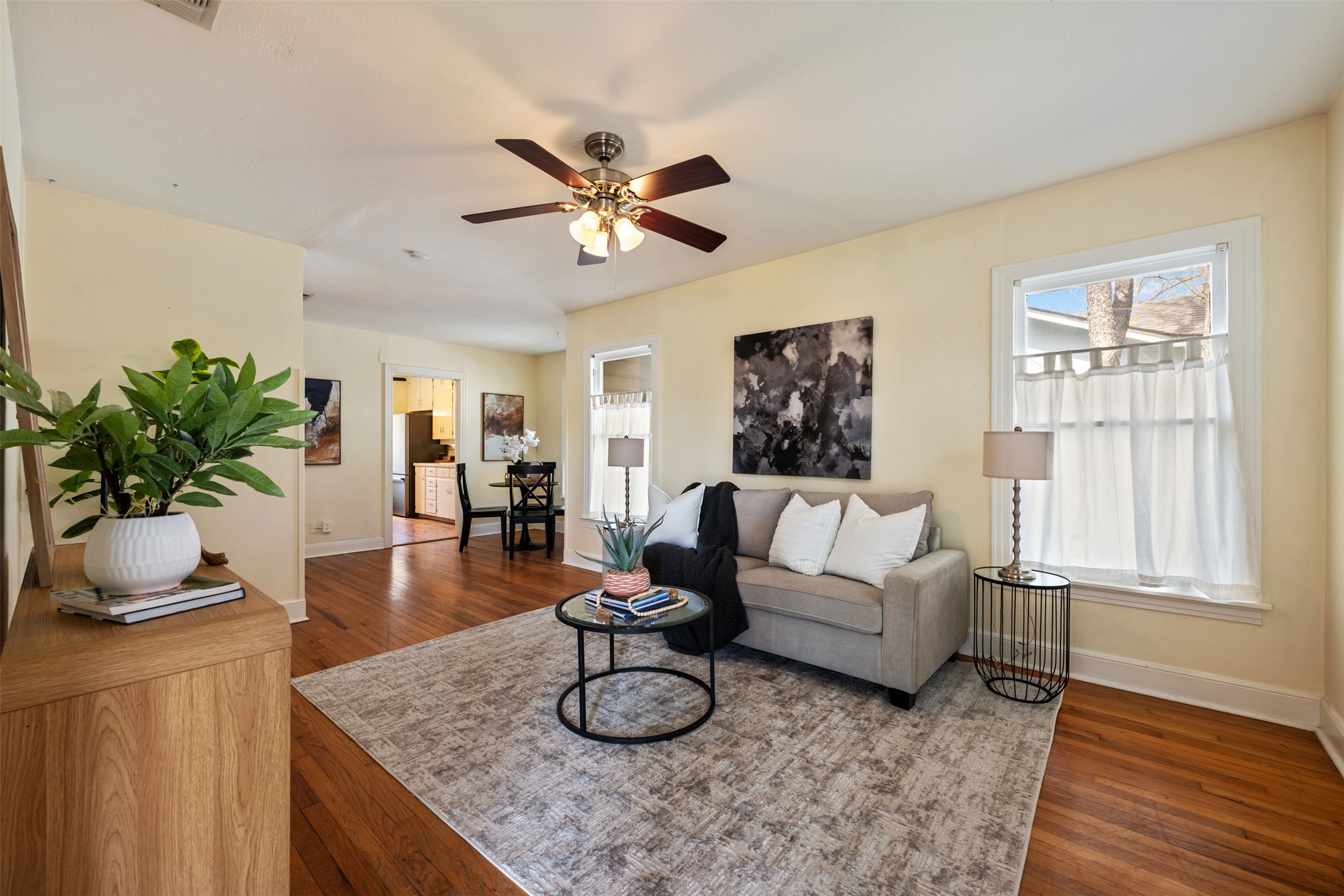 813 East 48th Street Austin, TX 78751 - Photo 7 of 37 a living room with furniture a window and wooden floor