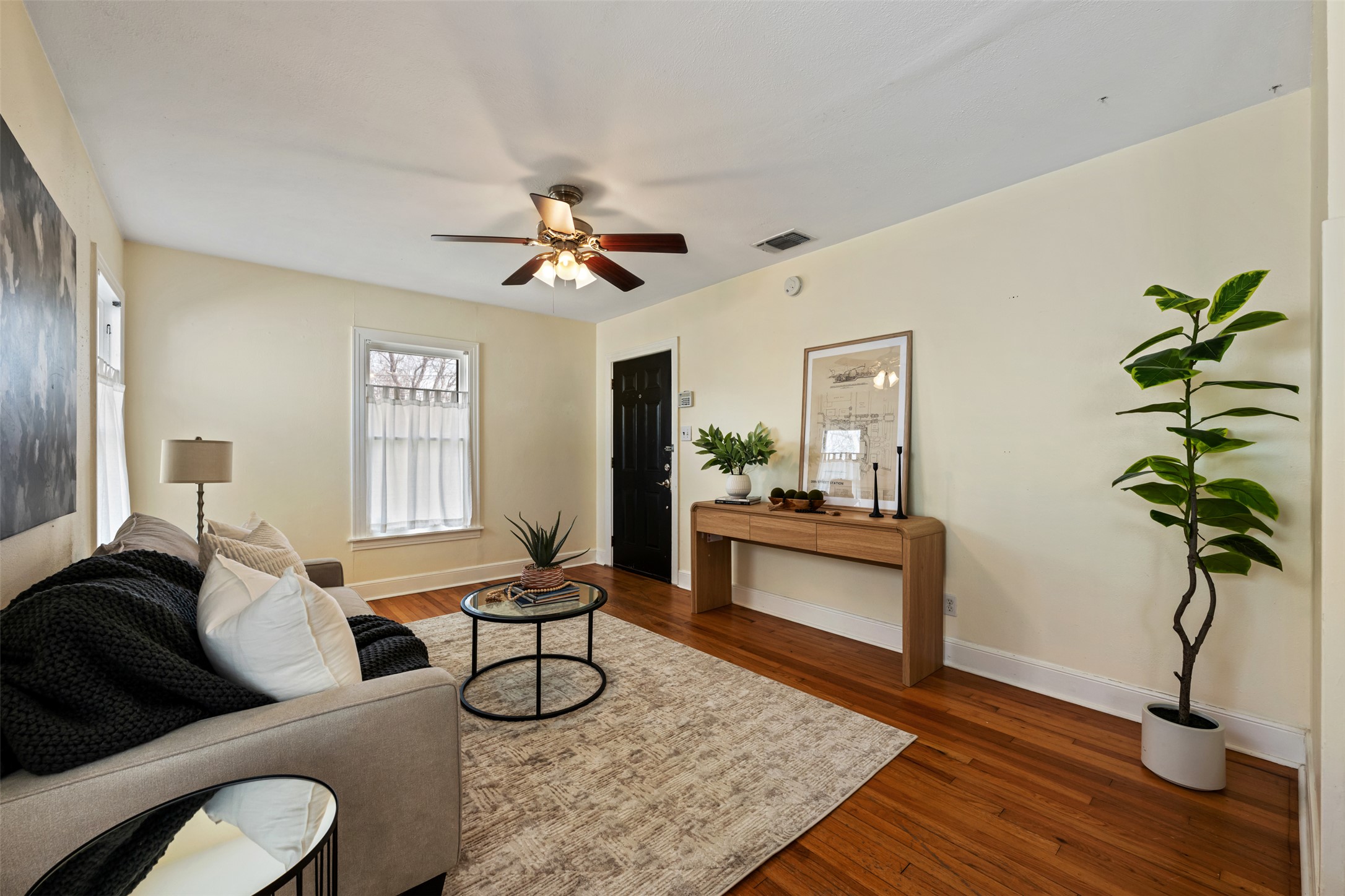 813 East 48th Street Austin, TX 78751 - Photo 10 of 37 a living room with furniture a window and a potted plant