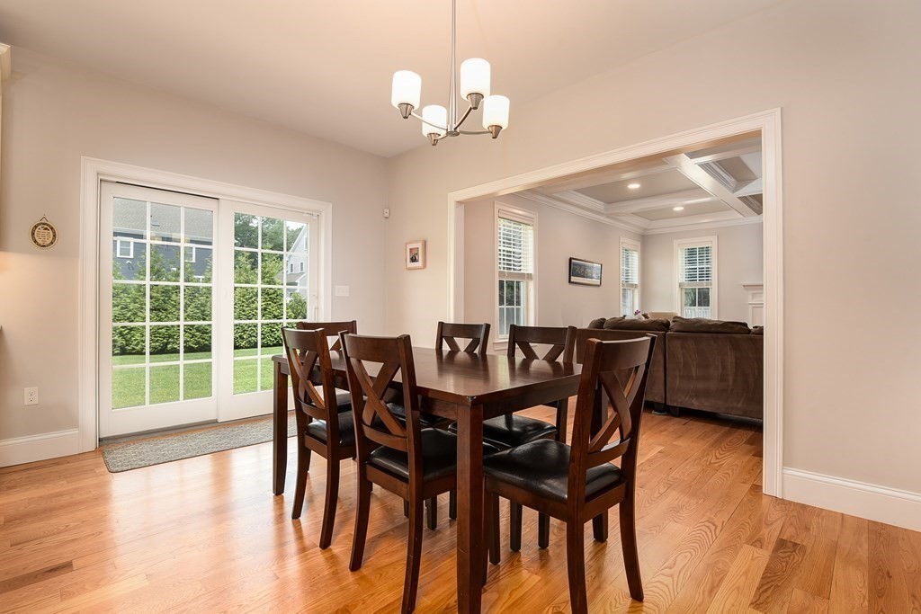 221 Valley Road Needham, MA 02492 - Photo 13 of 42 a view of a dining room with furniture and wooden floor