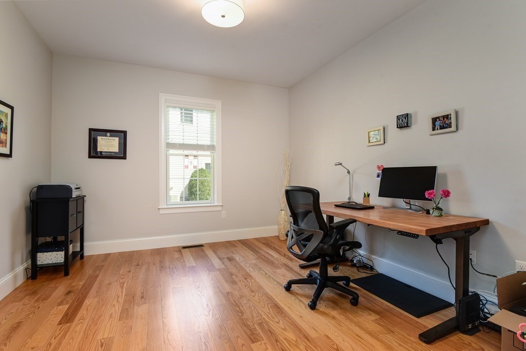 221 Valley Road Needham, MA 02492 - Photo 17 of 42 a view of a workspace with furniture and a window