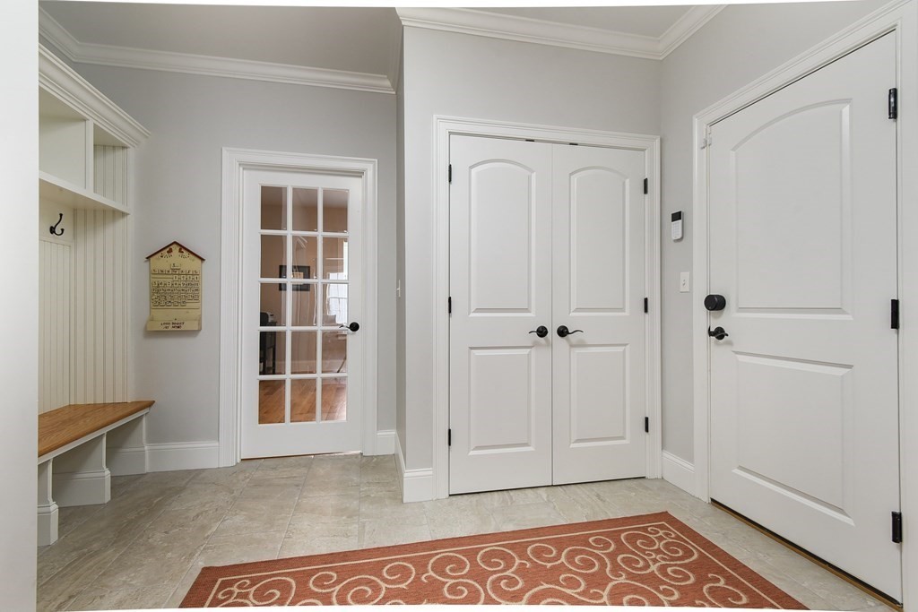 221 Valley Road Needham, MA 02492 - Photo 19 of 42 a view of an empty room with window and stairs