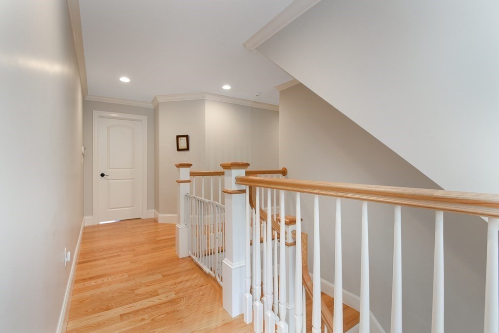 221 Valley Road Needham, MA 02492 - Photo 21 of 42 a view of hallway with wooden floor