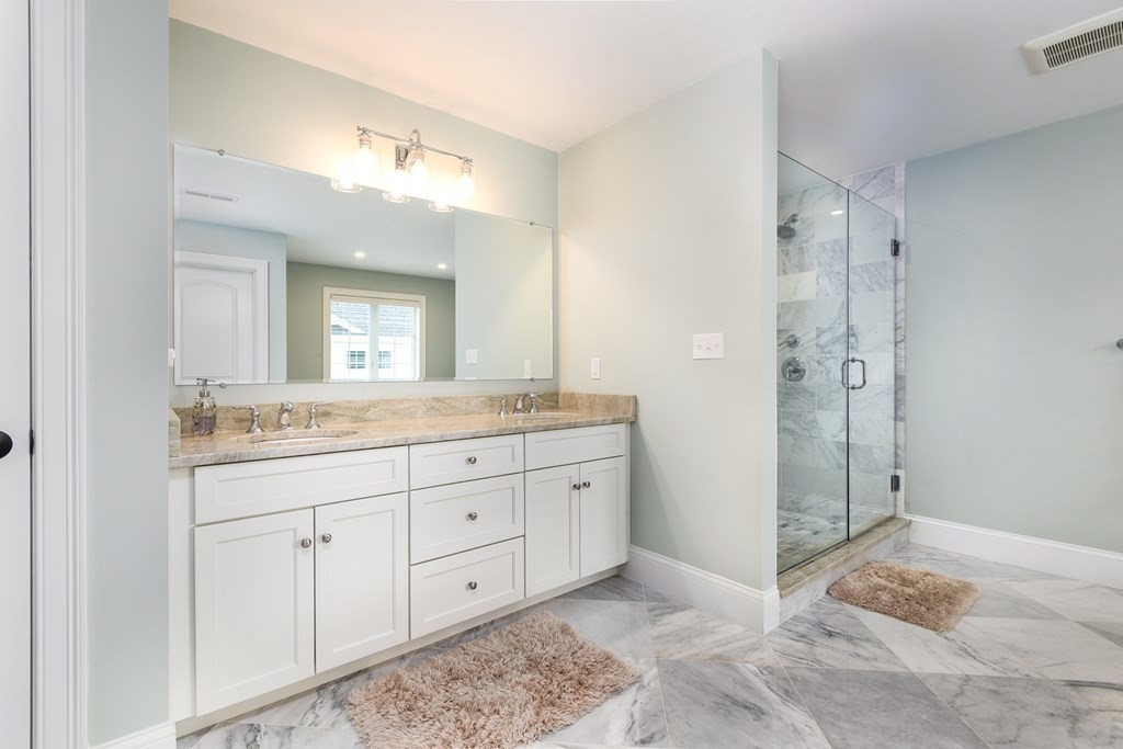 221 Valley Road Needham, MA 02492 - Photo 26 of 42 a spacious bathroom with a granite countertop sink mirror and a