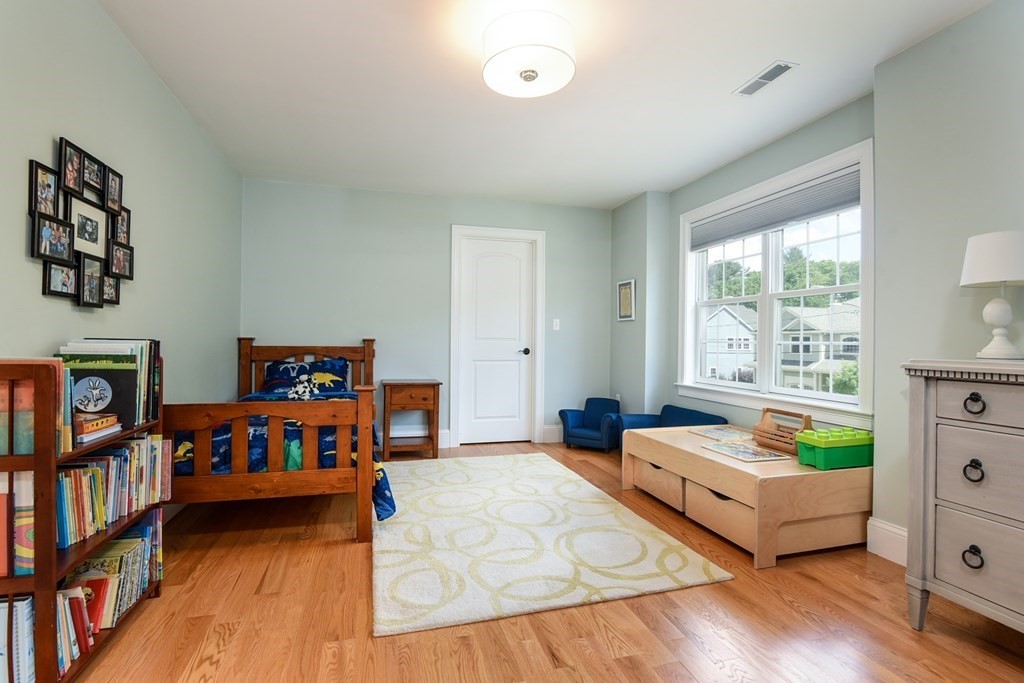 221 Valley Road Needham, MA 02492 - Photo 30 of 42 a living room with furniture and a window