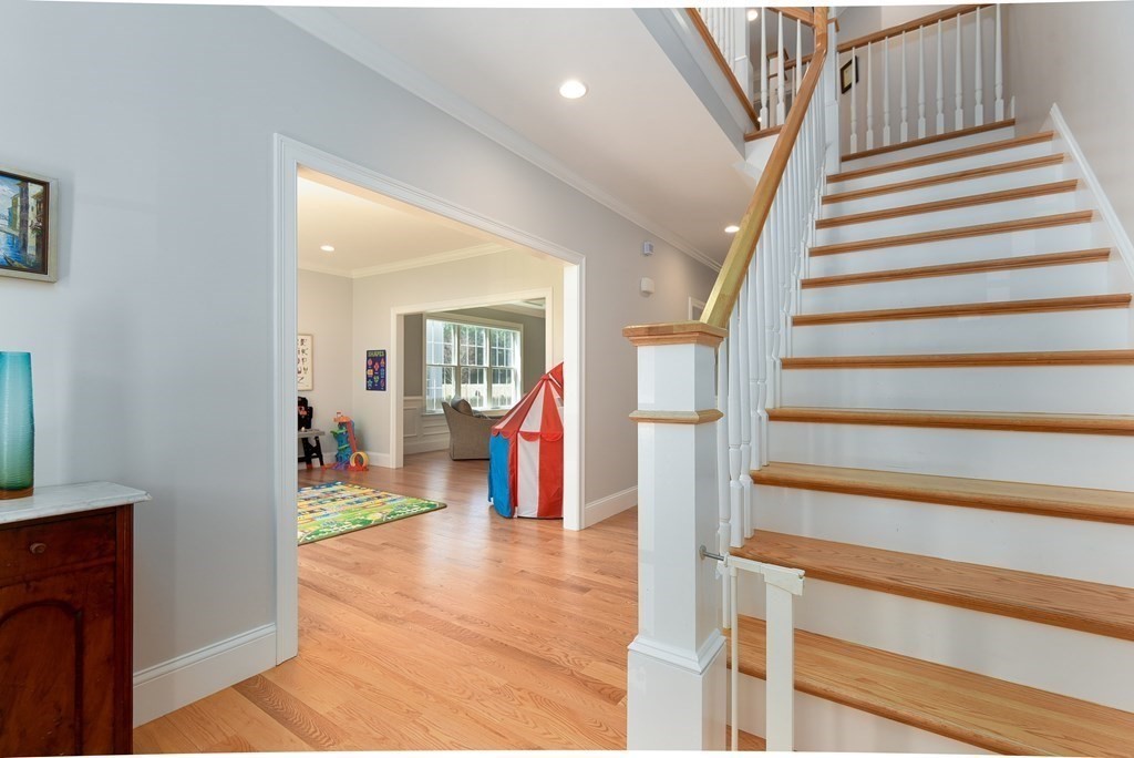 221 Valley Road Needham, MA 02492 - Photo 5 of 42 a view of entryway and hall with wooden floor