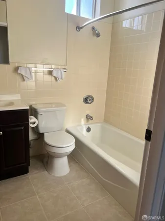 a bathroom with a toilet a sink and a bathtub