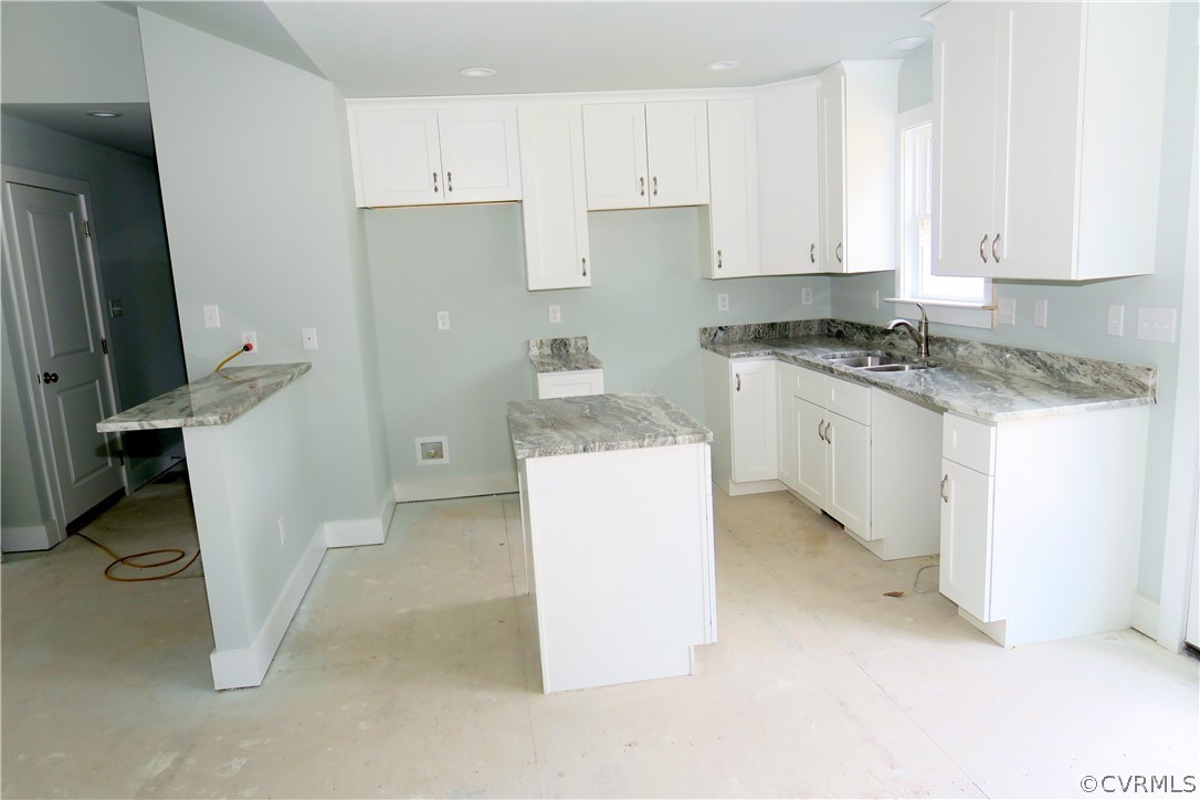 3824 Wood Dale Road Chester, VA 23831 - Photo 6 of 13 a kitchen with a sink stove and cabinets