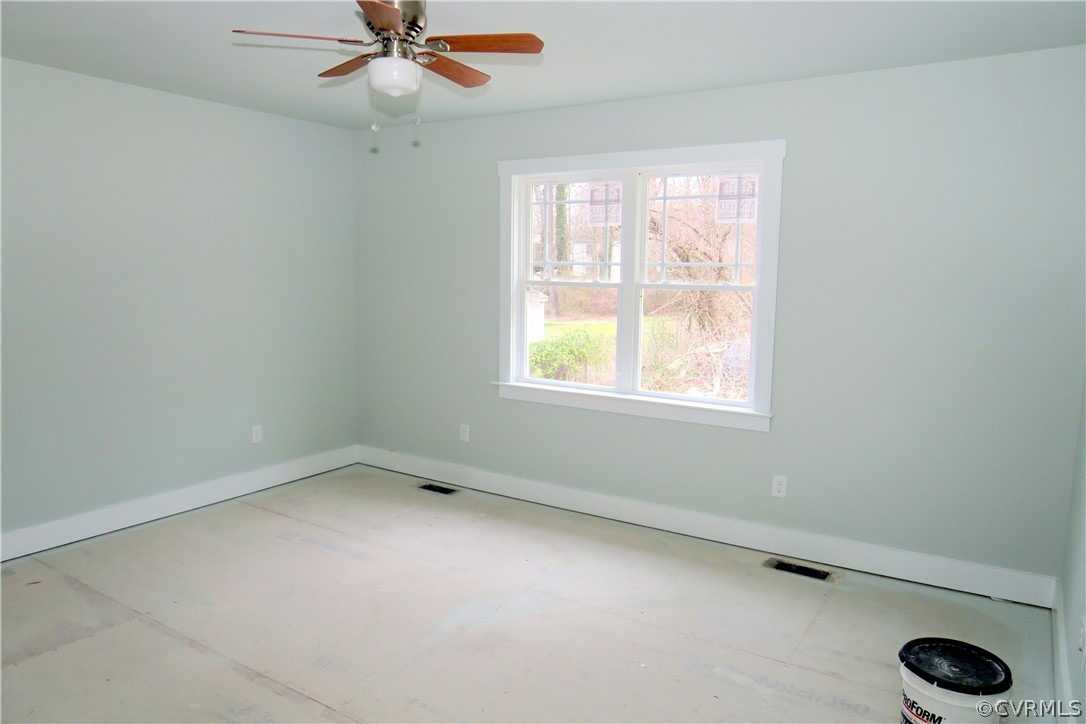 3824 Wood Dale Road Chester, VA 23831 - Photo 7 of 13 an empty room with ceiling fan and window