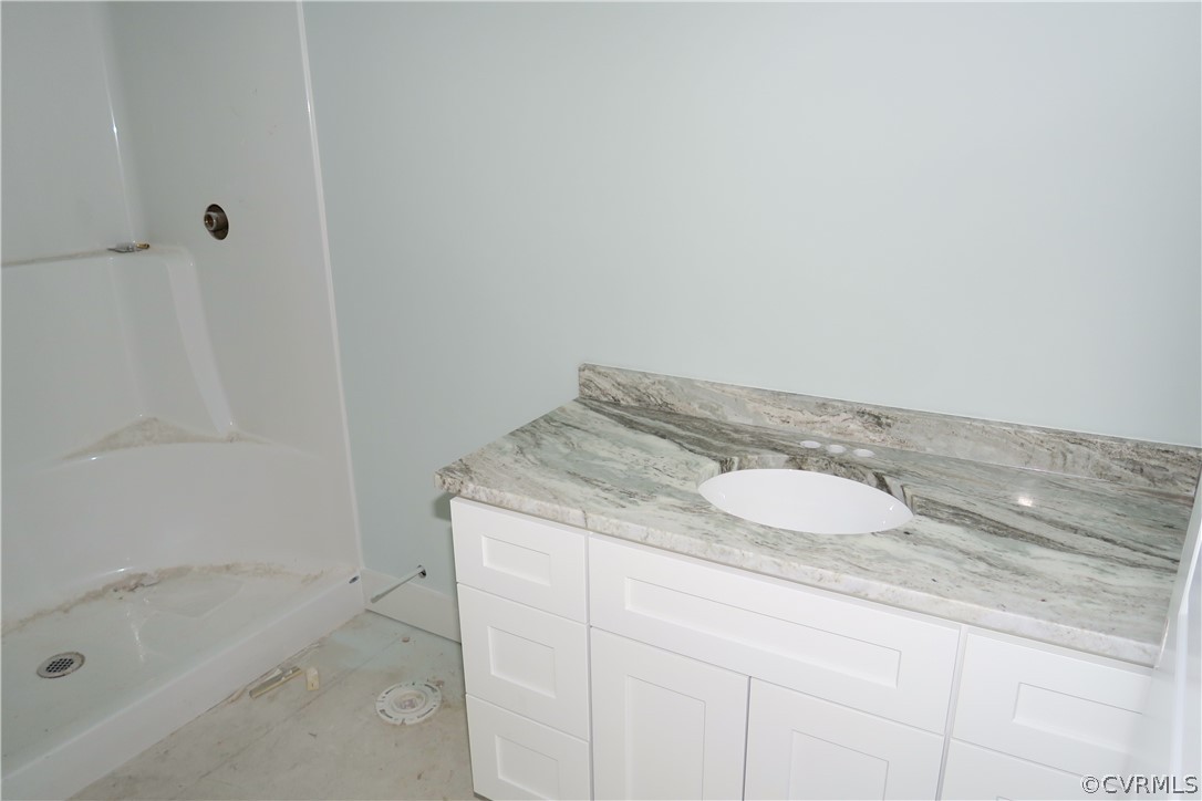 3824 Wood Dale Road Chester, VA 23831 - Photo 8 of 13 a bathroom with a granite countertop sink and a mirror