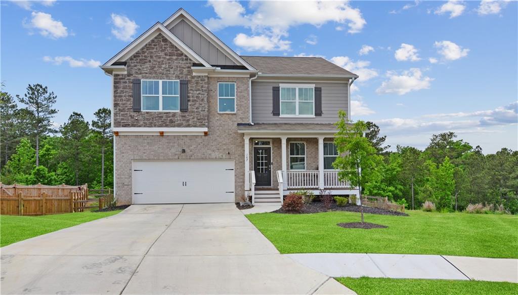 167 Wildflower Trace Dallas, GA 30132 - Photo 1 of 1 front view of house with a yard