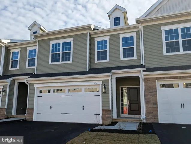 a front view of a house with a lots of windows