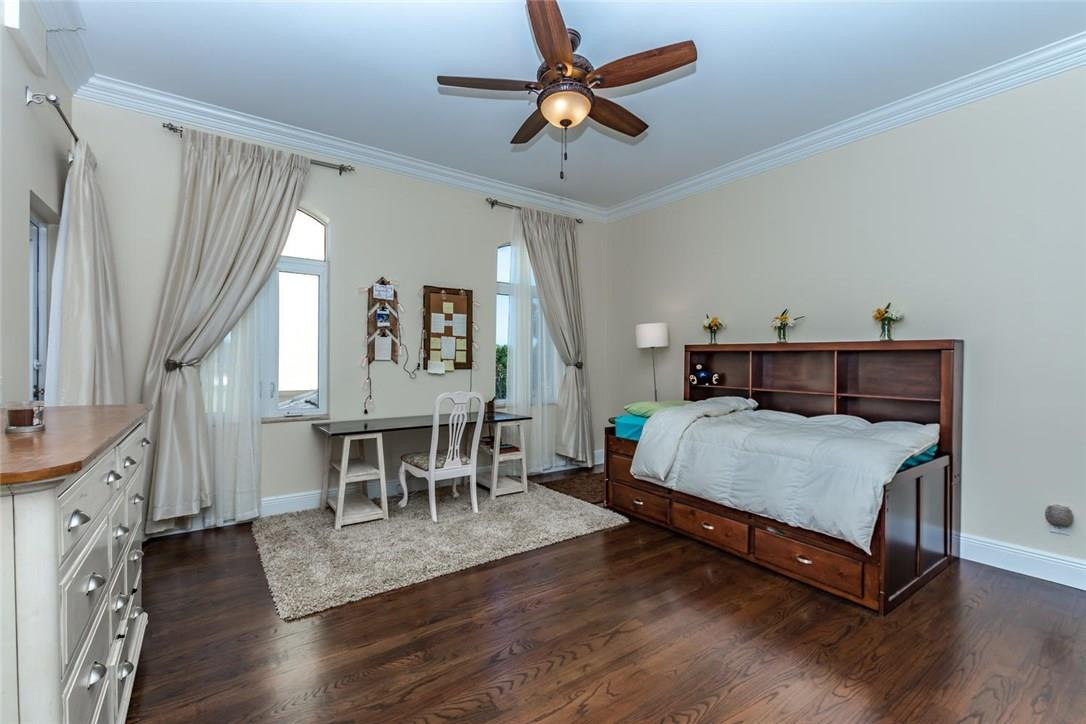 5702 Southwest 148th Avenue Southwest Ranches, FL 33330 - Photo 25 of 35 a bedroom with a bed chandelier and a window