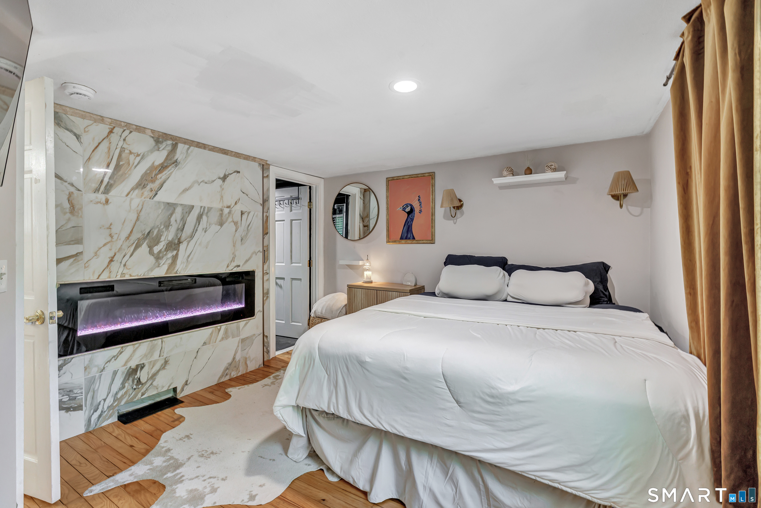 57 Olmstead Road Redding, CT 06896 - Photo 9 of 22 a bedroom with a bed and a painting on the wall
