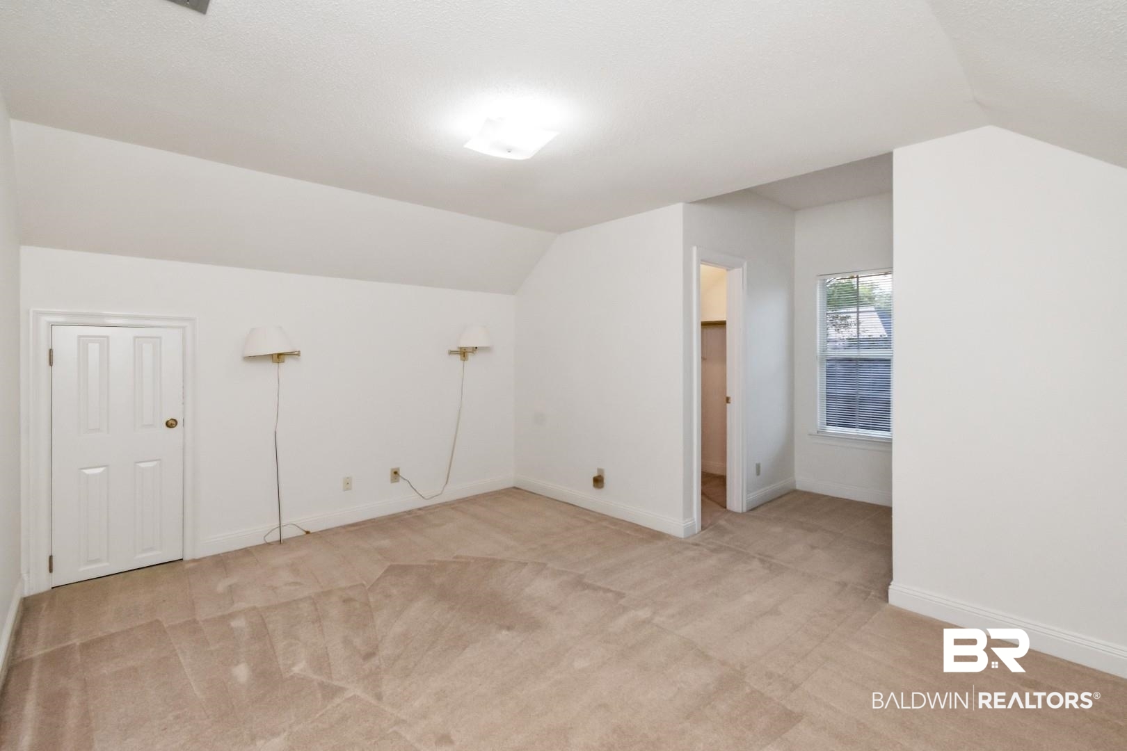 105 McHugh Lane Mobile, AL 36608 - Photo 19 of 30 Additional living space with vaulted ceiling and light carpet