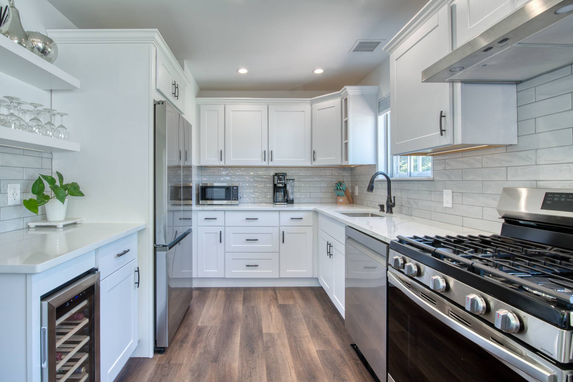 88 Old Country Road East Quogue, NY 11942 - Photo 3 of 10 a kitchen with cabinets appliances and a counter space