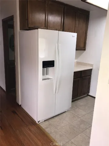 a white refrigerator freezer sitting in a kitchen