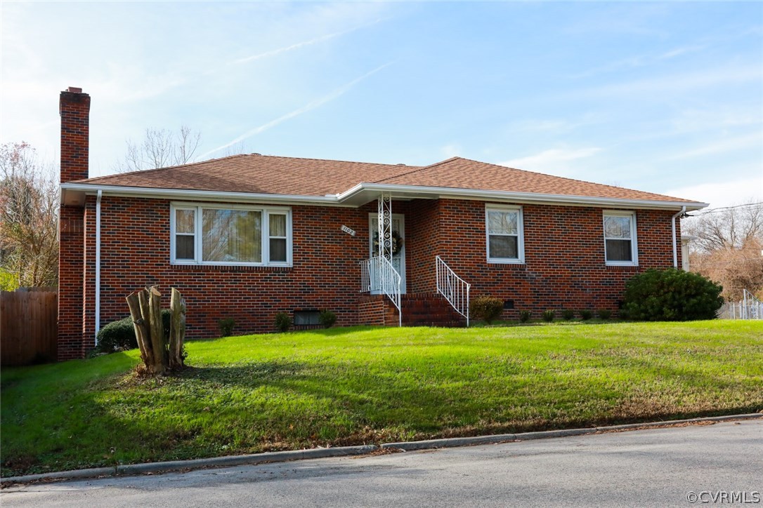 1102 Arlington Road Hopewell, VA 23860 - Photo 1 of 50 a front view of a house with a yard