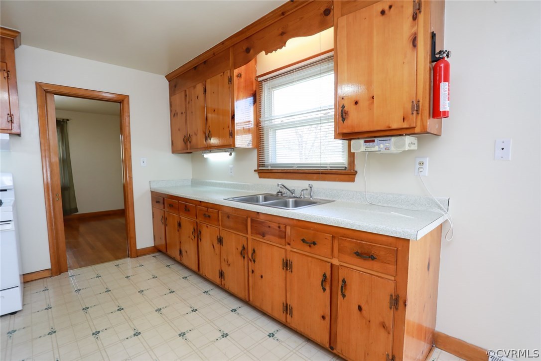 1102 Arlington Road Hopewell, VA 23860 - Photo 14 of 50 a kitchen with granite countertop a sink and cabinets