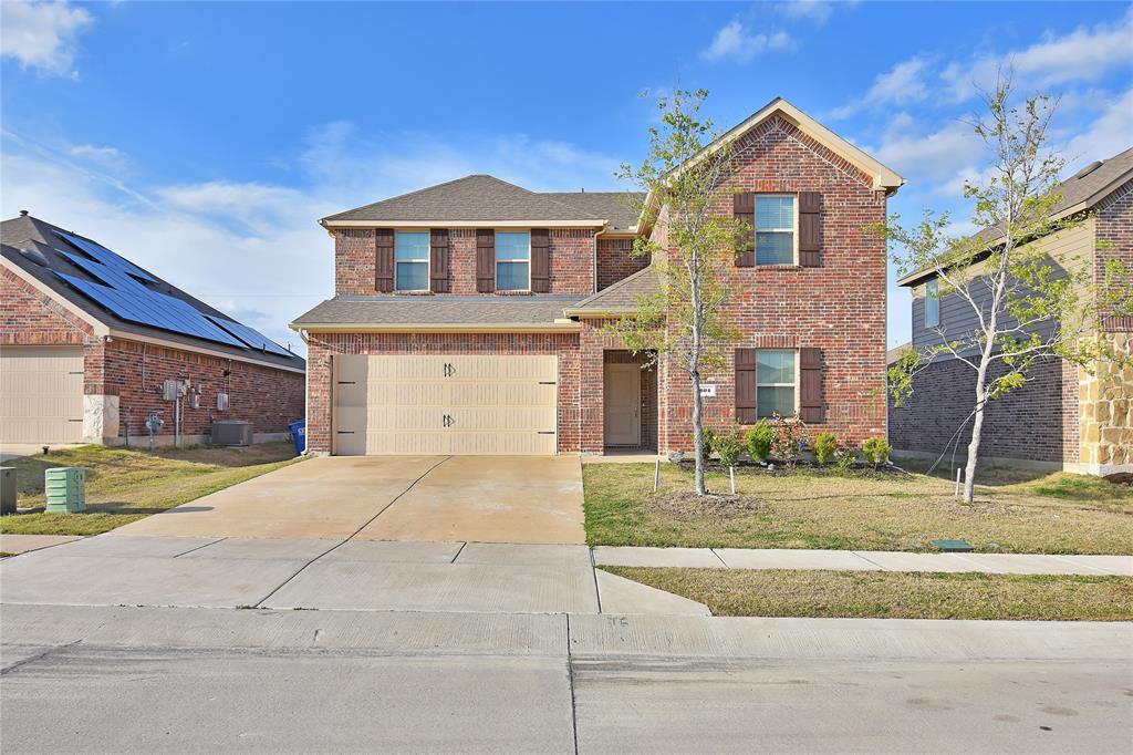 604 Gunsmoke Trail Princeton, TX 75407 - Photo 1 of 25 a front view of a house with garden