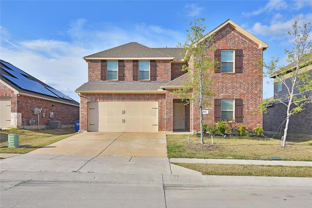 604 Gunsmoke Trail Princeton, TX 75407 - Photo 2 of 25 a front view of a house with garden