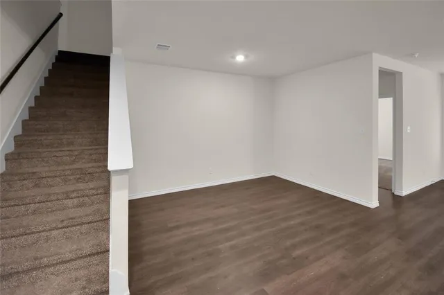 a view of an entryway with wooden floor