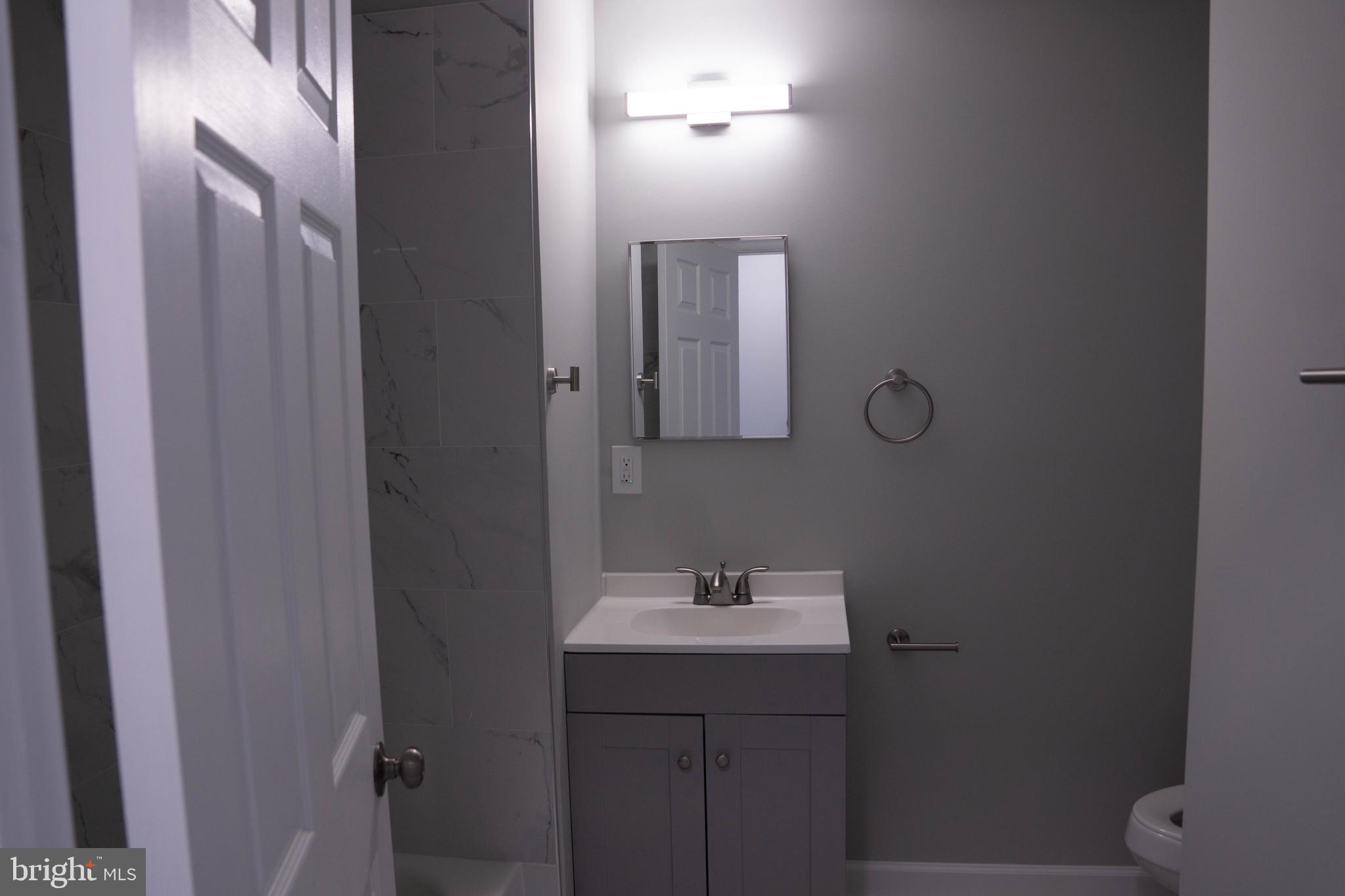 1009 Main Street, Unit 1 Fallston, MD 21047 - Photo 11 of 19 a bathroom with a sink and mirror