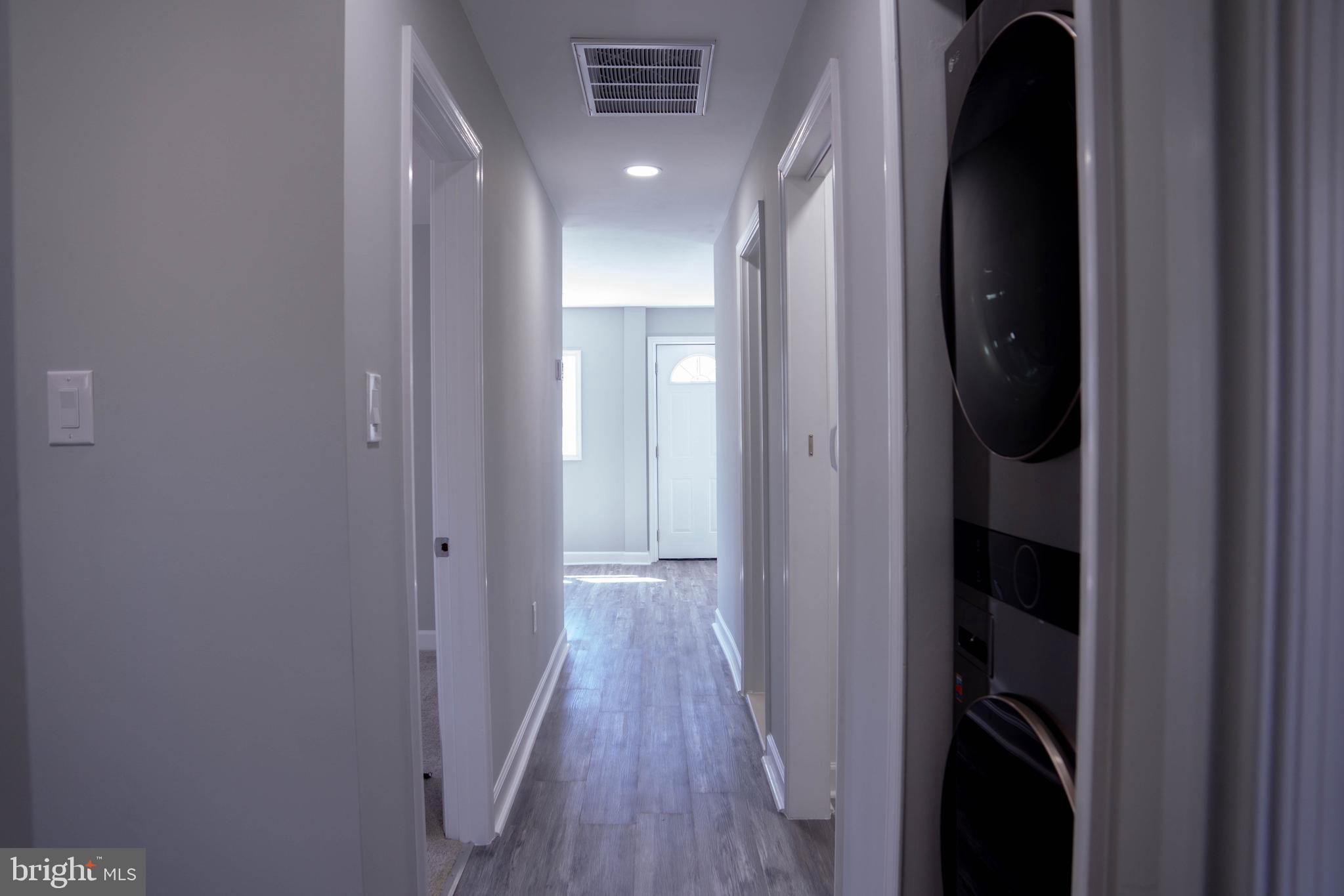 1009 Main Street, Unit 1 Fallston, MD 21047 - Photo 17 of 19 a view of a hallway with wooden floor and closet