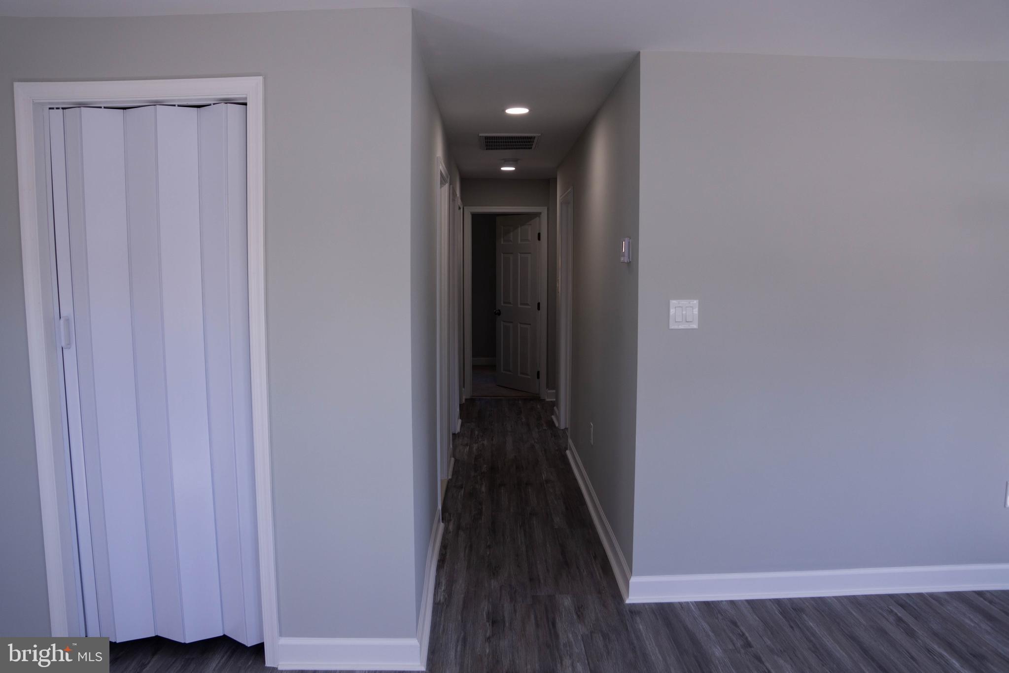 1009 Main Street, Unit 1 Fallston, MD 21047 - Photo 4 of 19 a view of a hallway with wooden floor
