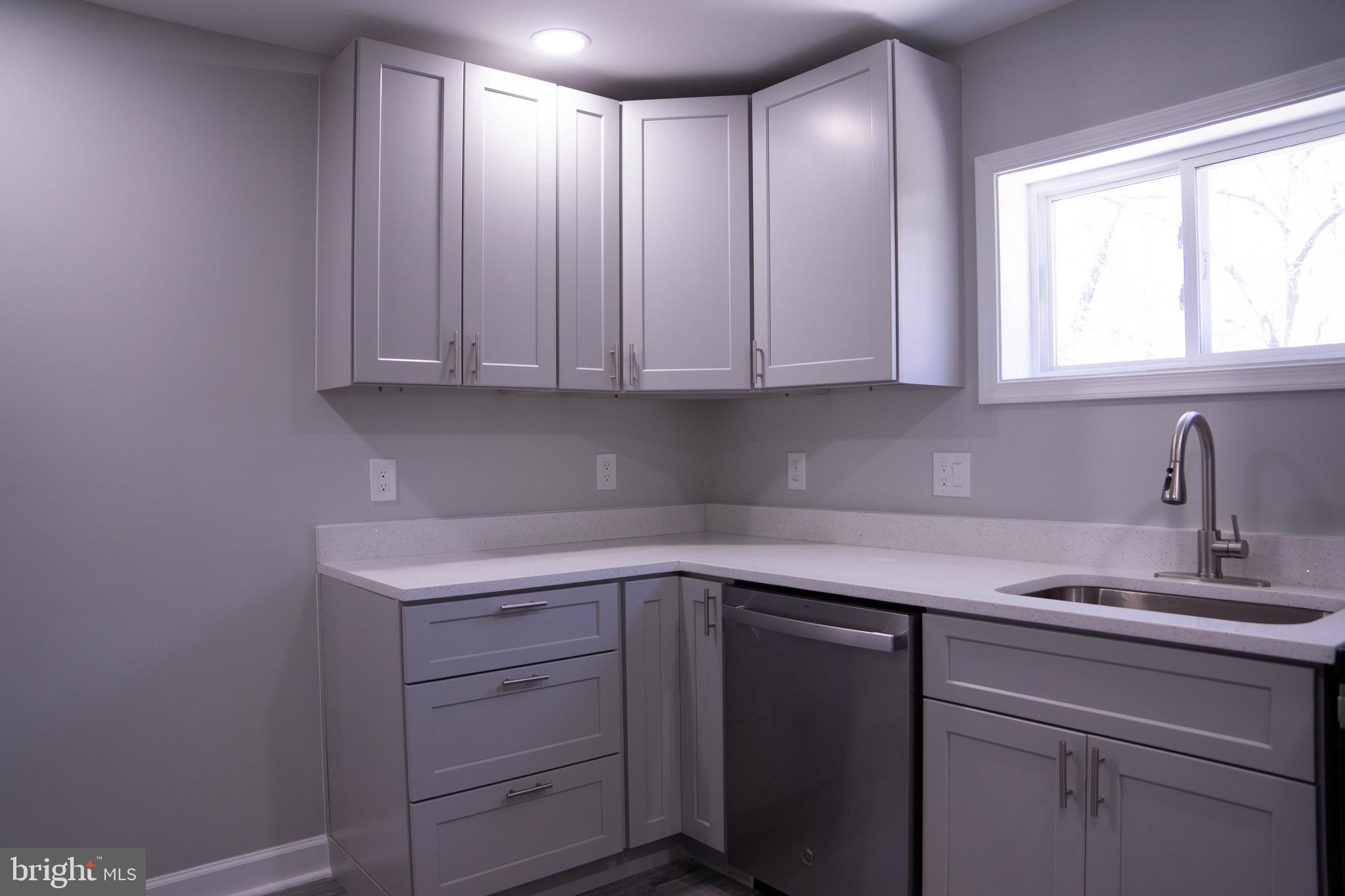 1009 Main Street, Unit 1 Fallston, MD 21047 - Photo 9 of 19 a kitchen with a sink cabinets and window