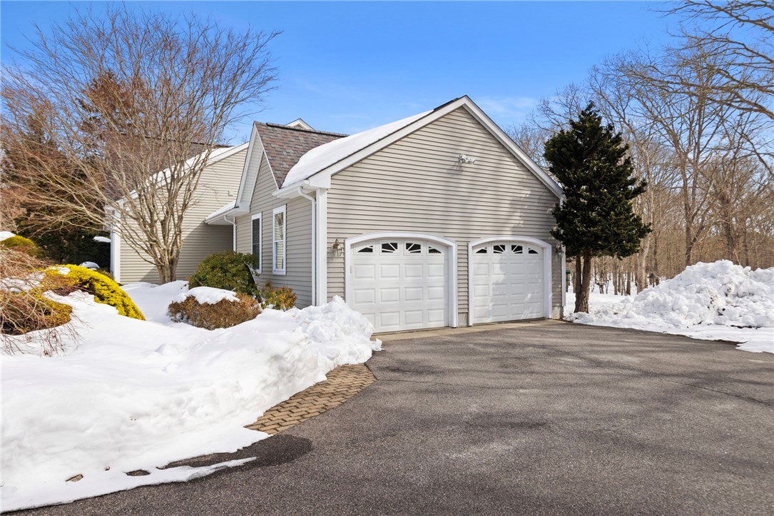 30 Fox Ridge Circle South Kingstown, RI 02879 - Photo 2 of 38 2-car garage leads to spacious mud room/laundry room offering great storage space. There's also a convenient lavette in this space.
